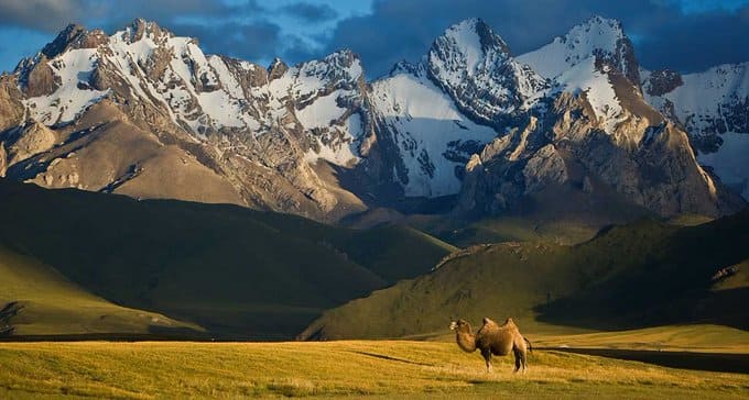 Ancient Silk Road between China and the Mediterranean. The Tian Shan mountains surrounding the old caravan route dominate the country and are home to snow leopards, lynx, horses and sheep, among others.